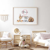 Name print with a pink initial above a kangaroo, koala and echidna, each wearing a pink and green flower crown.