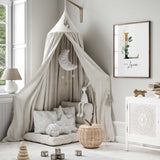 Gender neutral nursery print with personalised initial, soft green foliage and gold botanical details.