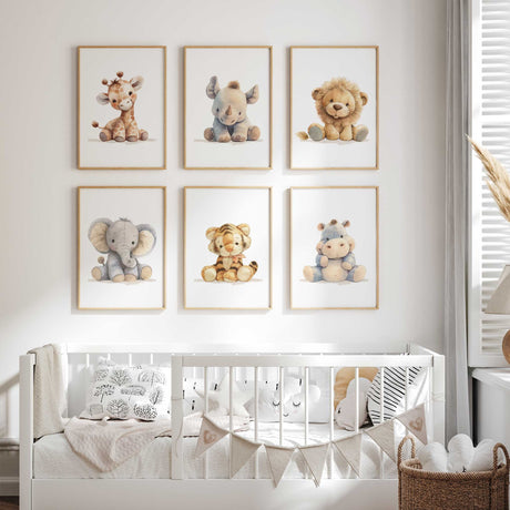 Safari nursery print set featuring giraffe, rhino, lion, elephant, tiger and hippo illustrations in warm muted colours.