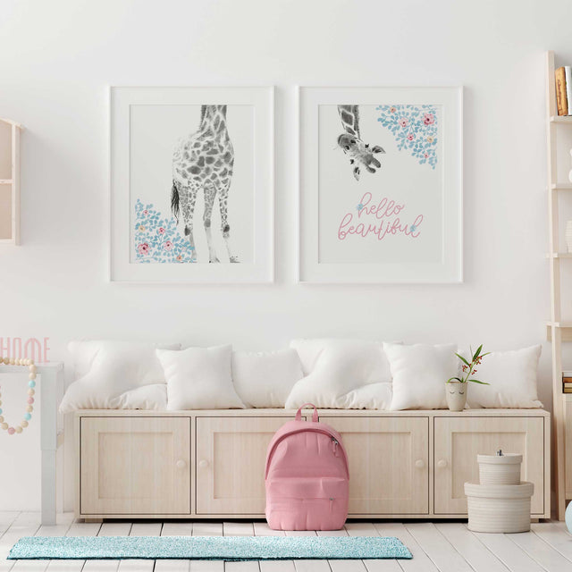 Giraffe girls nursery wall art with hanging giraffe, pastel branches and hello beautiful lettering for girls bedroom decor.