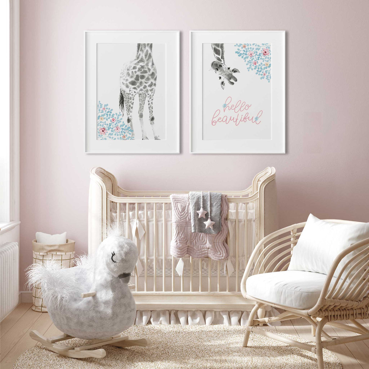 Set of two giraffe girls prints with hello beautiful text and soft floral details for coordinated nursery wall art.