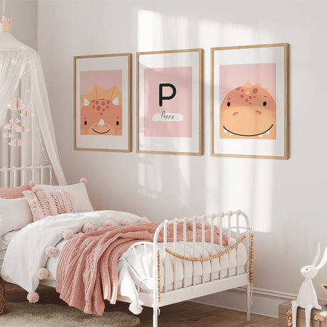 Three coordinating dinosaur prints with two pink dinosaurs and a personalised initial and name design