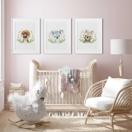 Australian baby animal print set with koala, platypus and wombat portraits, pink flowers and coordinating leafy wreaths.