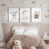 Girls floral animal nursery prints with personalised initial and soft pink botanical accents for baby room styling