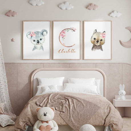 Girls floral animal nursery prints with personalised initial and soft pink botanical accents for baby room styling