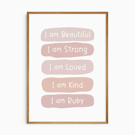 Pink affirmation print with white lettering reading I am Beautiful, Strong, Loved and Kind, ending with I am name