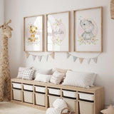 Girls safari nursery wall art set with lion cub, elephant, and soft floral details