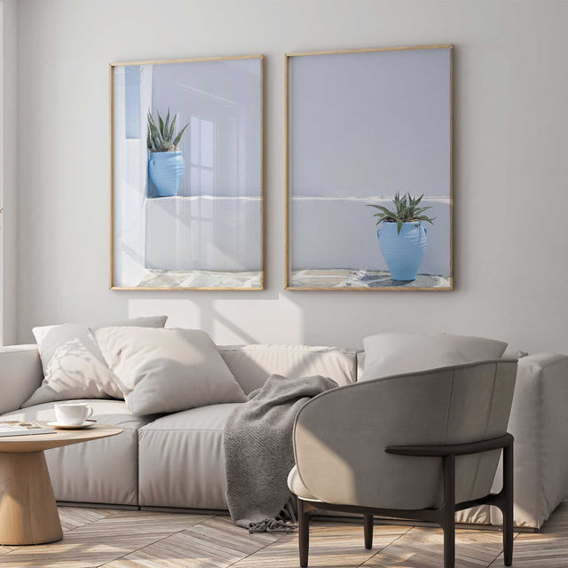 Greek-inspired wall art set of two with blue pots, green plants and softly textured white architecture