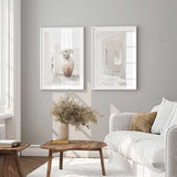 set of two mediterranean prints showing white archway and terracotta urn scene