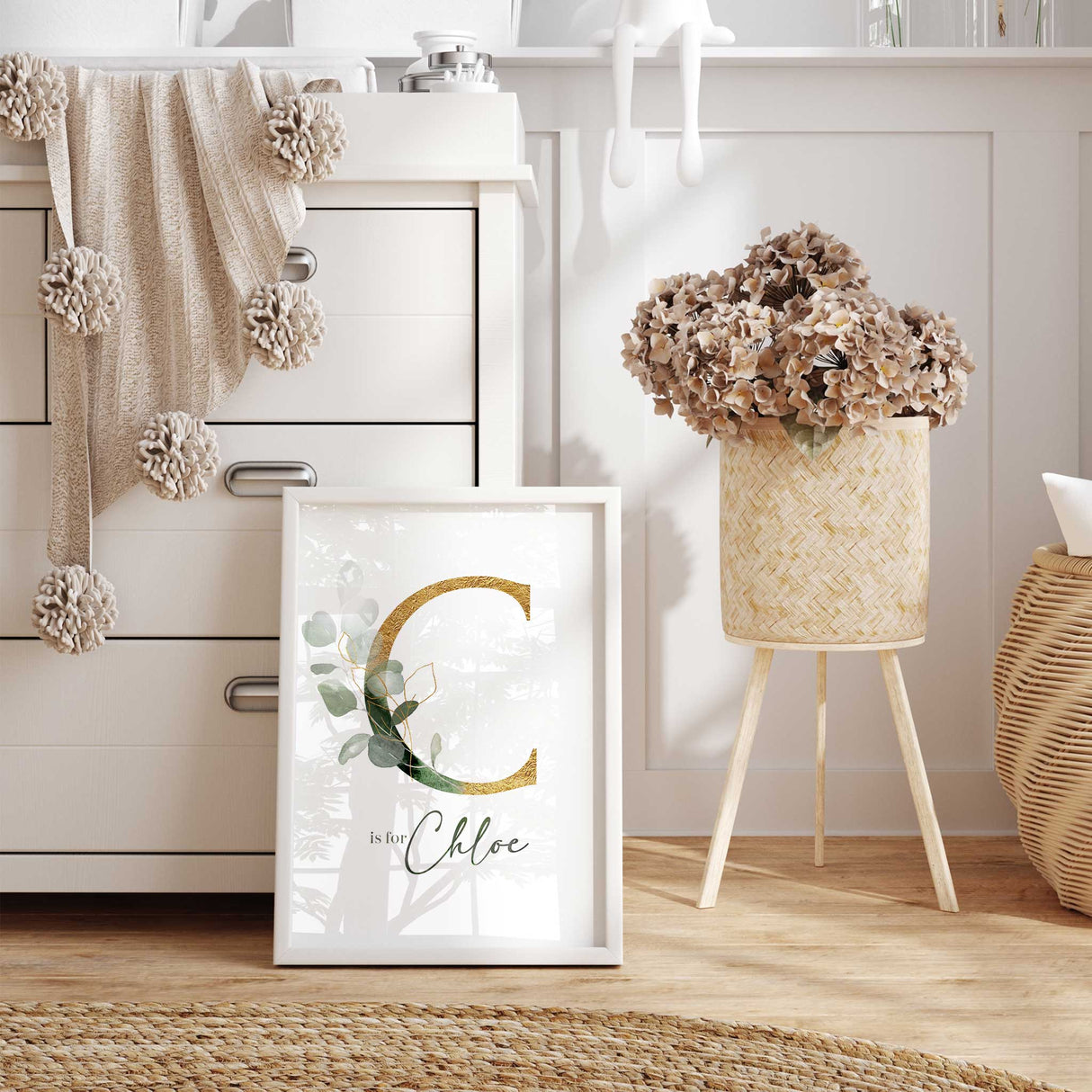 Green and gold nursery wall art featuring a personalised initial, botanical leaves and custom name.