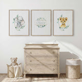 Green safari baby room wall art set featuring lion, elephant and personalised nursery print