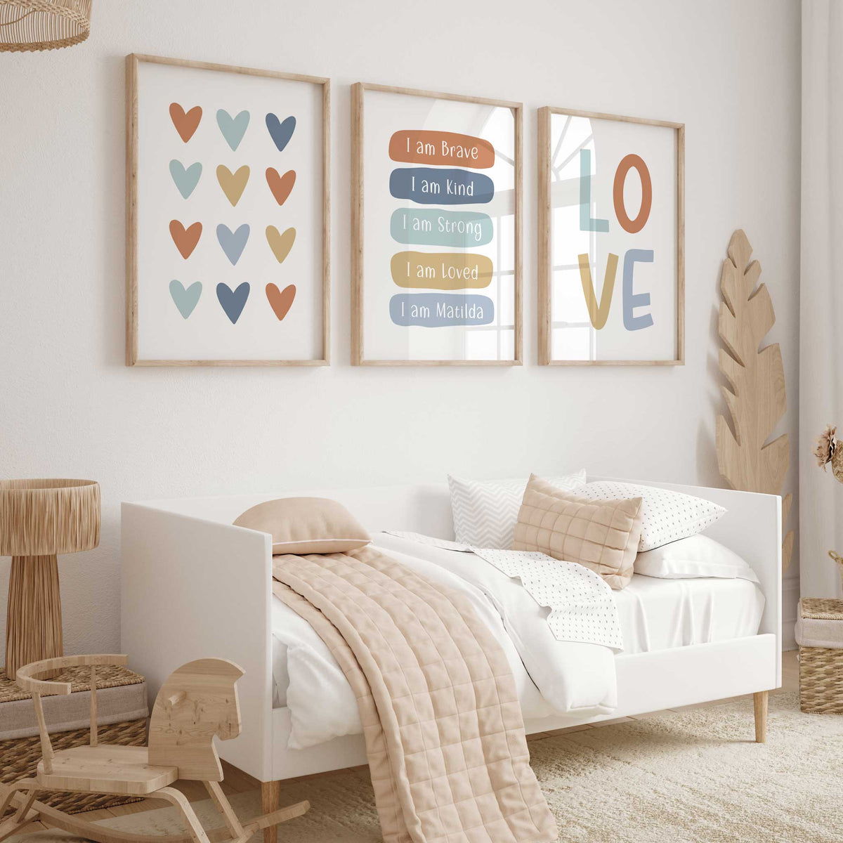 Kids wall art trio featuring multicoloured hearts, LOVE typography and affirmations including I am Brave