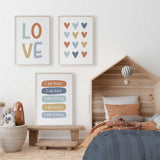 Heart and affirmation print set with LOVE lettering and I am statements on terracotta, blue, aqua and mustard panels.