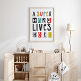 Hero themed kids wall art print with bold shapes and fun letters