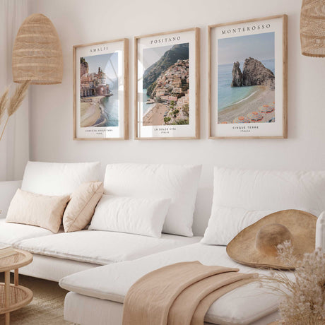Italian coastal print trio showing pastel buildings, blue water and striped beach parasols, with black place names.