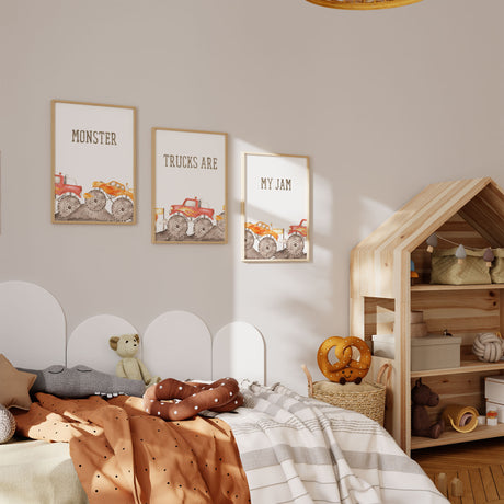 Three monster truck wall art prints showing red and orange trucks beneath Monster, Trucks Are and My Jam lettering.