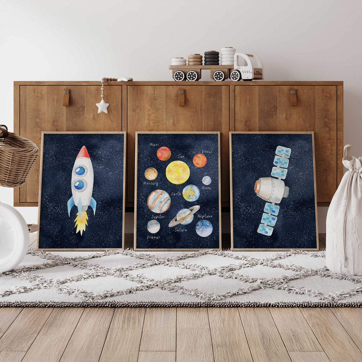 Space themed wall art prints styled in a kids bedroom