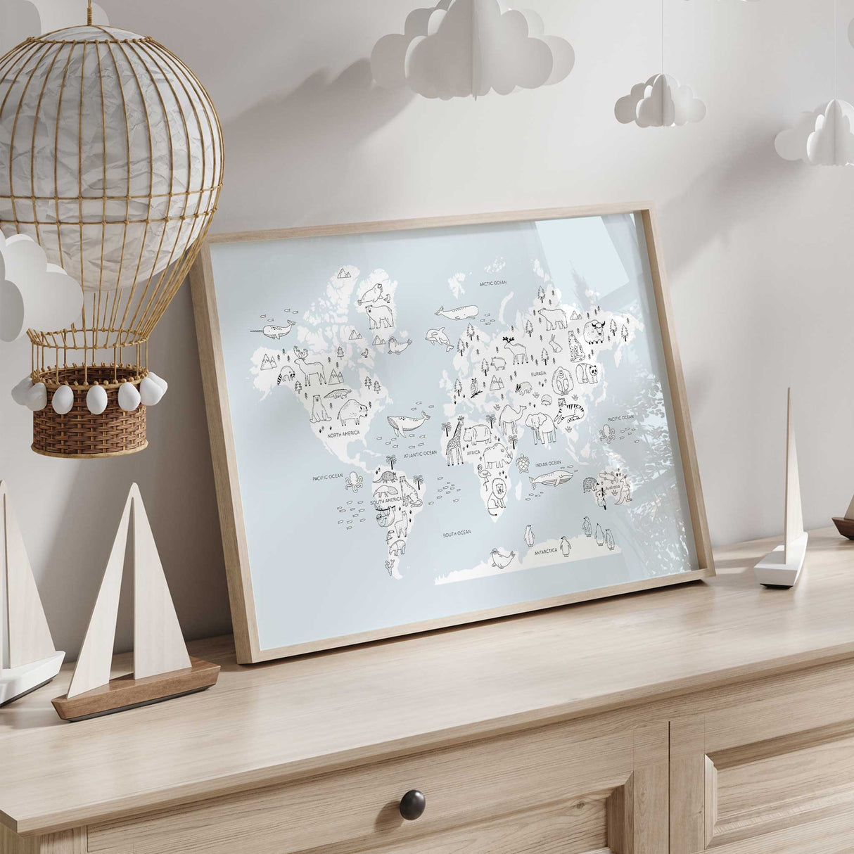 Illustrated world map featuring animals from different continents, perfect for kids nursery and bedroom décor