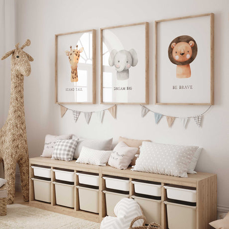 Set of three kids' safari wall art prints with lion, elephant, and giraffe for nursery decor.