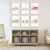 Set of six watercolour prints featuring an ambulance, taxi, fire truck, rubbish truck, police car and school bus.