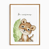 Leopard nursery print with quote “Be curious,” featuring green leaf background, ideal wall art for jungle or safari-themed kids room.