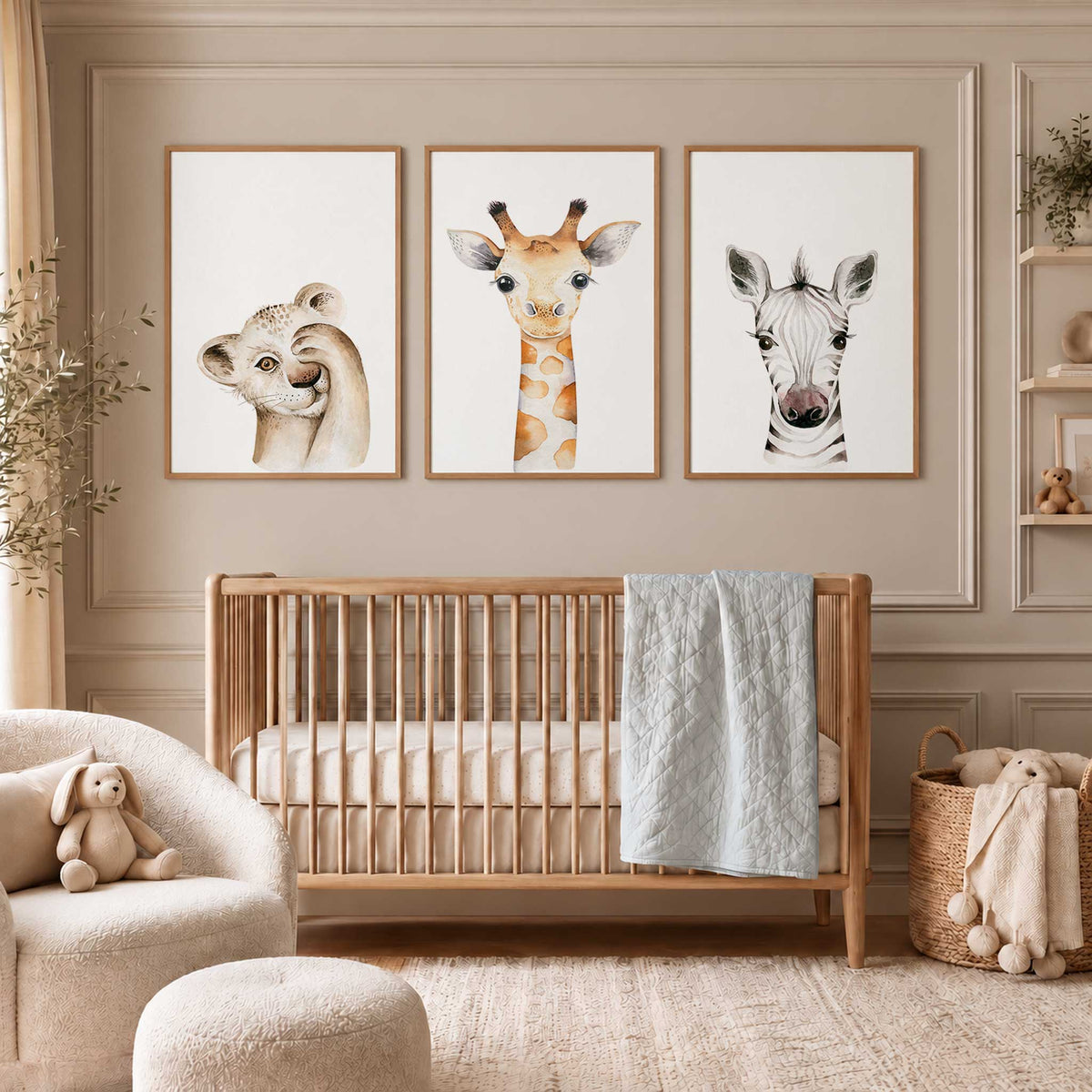 Set of three baby safari nursery prints featuring watercolour portraits of a lion cub, giraffe and zebra on white backgrounds.