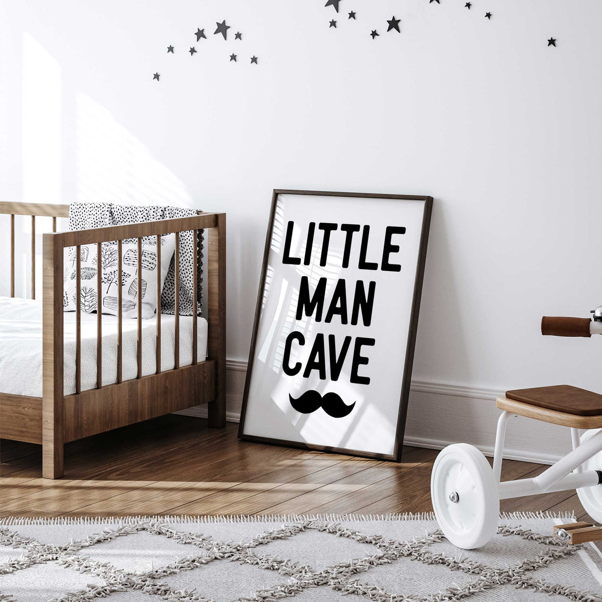 Little Man Cave’ nursery print with a playful moustache graphic for boys room decor