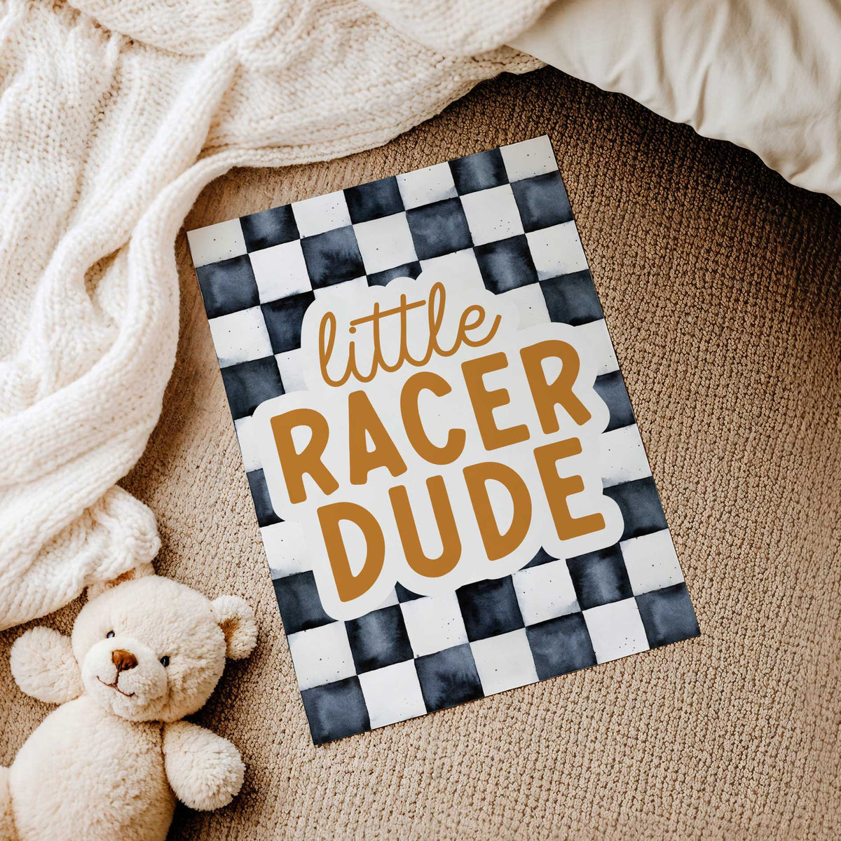 Unframed Little Racer Dude print featuring ochre lettering, an off-white text outline and watercolour-style charcoal checks.