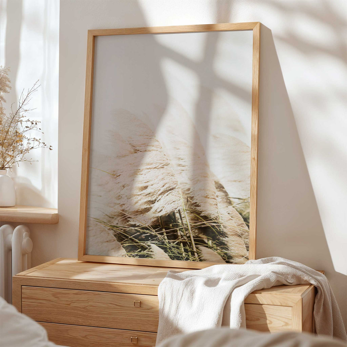 Close up of beige pampas grass displayed in a stylish wooden frame. perfect for bedroom wall art