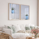 Mediterranean blue pot wall art pair with whitewashed architectural details and understated coastal colours