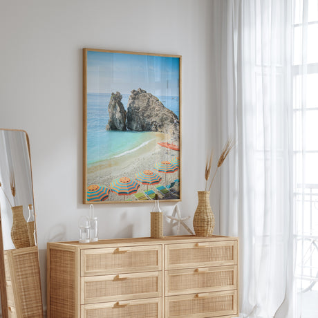 Mediterranean beach view with umbrellas and seaside cliffs