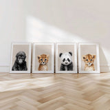 Modern safari animal nursery prints in neutral tones, featuring elephant, lion, zebra and giraffe baby portraits for gender neutral kids room decor.
