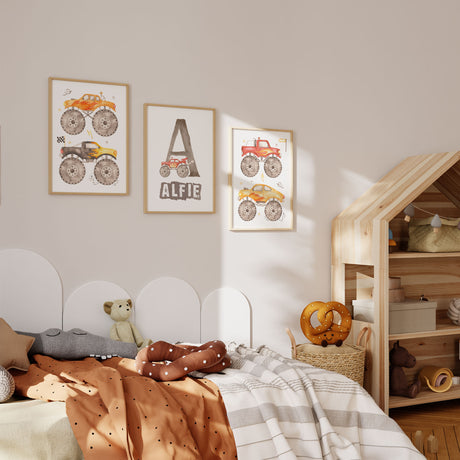 Three colourful monster truck prints displayed together in a boys bedroom with a personalised name design in the centre.