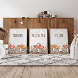 Set of three monster truck prints with red and orange trucks, dirt track details and Monster Trucks Are My Jam lettering.