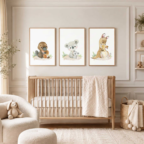 Mother koala, kangaroo and platypus with their babies, illustrated in watercolour with small green plants on white.