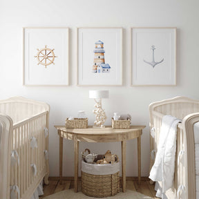 Nautical nursery wall art set featuring anchor, lighthouse, and ship wheel prints for boys' bedrooms