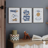 Navy space nursery decor prints with rockets, stars and moon quote design