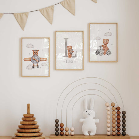 Bear nursery prints with a pilot bear, grey initial and name with balloon bear, and bear riding a grey toy car.