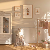 Neutral circus theme nursery art set with illustrated characters in soft beige and brown for kids rooms.