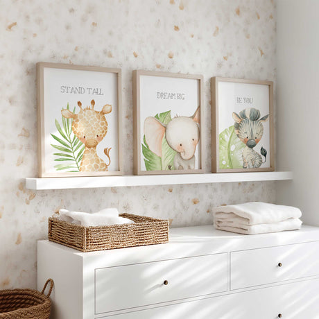 Neutral safari baby room wall art with leafy green accents