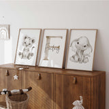 Neutral safari nursery prints set including personalised name initial with baby lion and elephant illustrations for kids room or nurserywall art