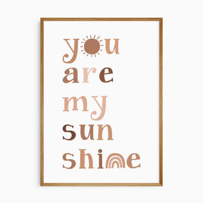 Neutral sunshine nursery wall art with playful typography for a baby room
