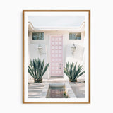 Palm Springs pink door wall art print with white border, mid-century modern home decor photography.