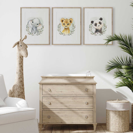 Safari nursery animal wall art set featuring baby elephant, panda and lion cub illustrations in neutral watercolour style for kids bedroom decor.