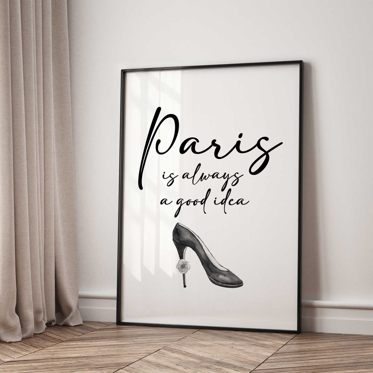 Paris is always a good idea in black script lettering above a grey high-heeled shoe with a small rose on the heel.