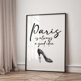 Paris is always a good idea in black script lettering above a grey high-heeled shoe with a small rose on the heel.