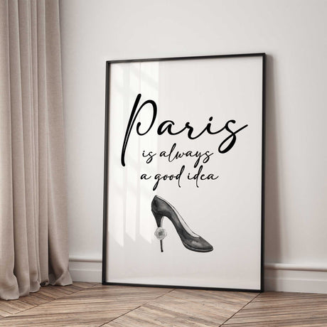 Paris is always a good idea in black script lettering above a grey high-heeled shoe with a small rose on the heel.