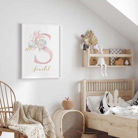 Floral initial name print with a large pastel flower letter and personalised gold-style script on a white background.