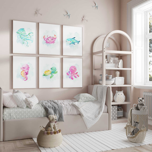Ocean nursery wall art set featuring jellyfish, crab, shark, seahorse, turtle and octopus prints in soft pastel colours