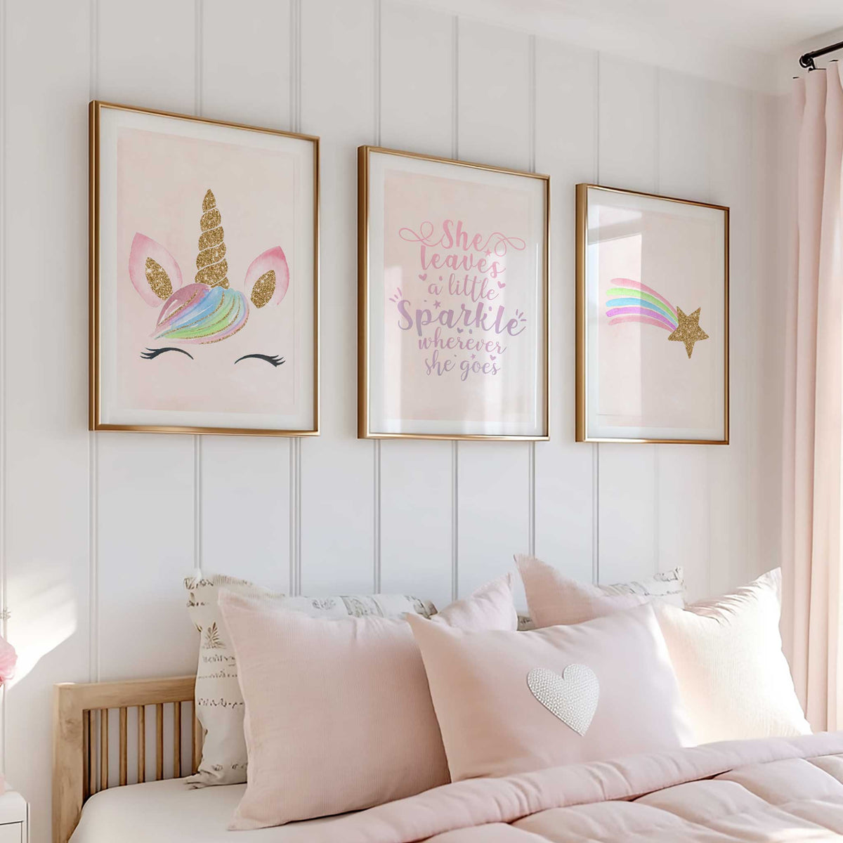 Three pastel pink prints showing a gold-effect shooting star, a pink and lilac sparkle quote and a rainbow-maned unicorn.